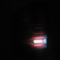 Thumbnail for AlphaRex 14-18 GMC Sierra 1500/2500HD/3500HD LUXX-Series LED Tail Lights Blk/Red w/Actv Lgt Seq. Sig