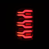 Thumbnail for AlphaRex 19-21 Dodge Ram 1500 Luxx-Series LED Tail Lights Black/Red w/Activ Light/Seq Signal
