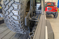 Thumbnail for DV8 Offroad 2019+ Jeep Gladiator Universal Stand Up In-Bed Tire Carrier